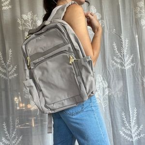 Gray backpack with gold details